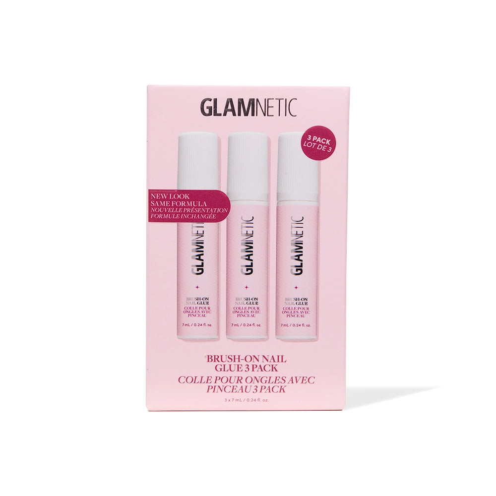 A pink box labeled glamnetic Glue Trio contains three tubes of Brush-On Nail Glue, perfect for securing your favorite press-on nails. The packaging showcases "3 pack" and "new look, same formula," making it easy to achieve a salon-quality manicure at home. Text appears in both English and French, with images of the glue tubes visible through the front.