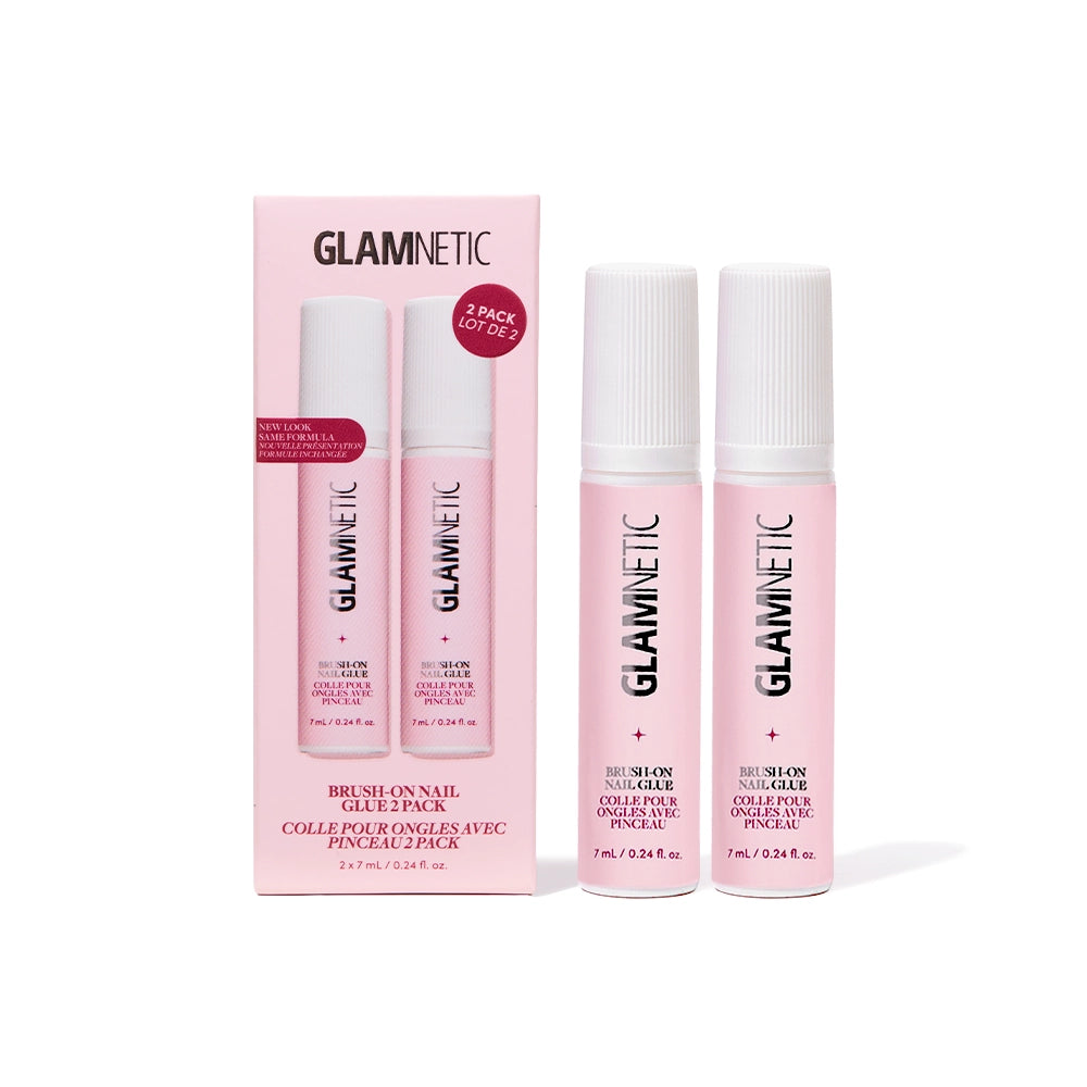 Two pink tubes of glamnetic Glue Duo stand beside their matching pink box, which features the glamnetic logo and product details in bold black and white text. Specially formulated for seamless press-on nail application, this adhesive delivers salon-quality results right at home.