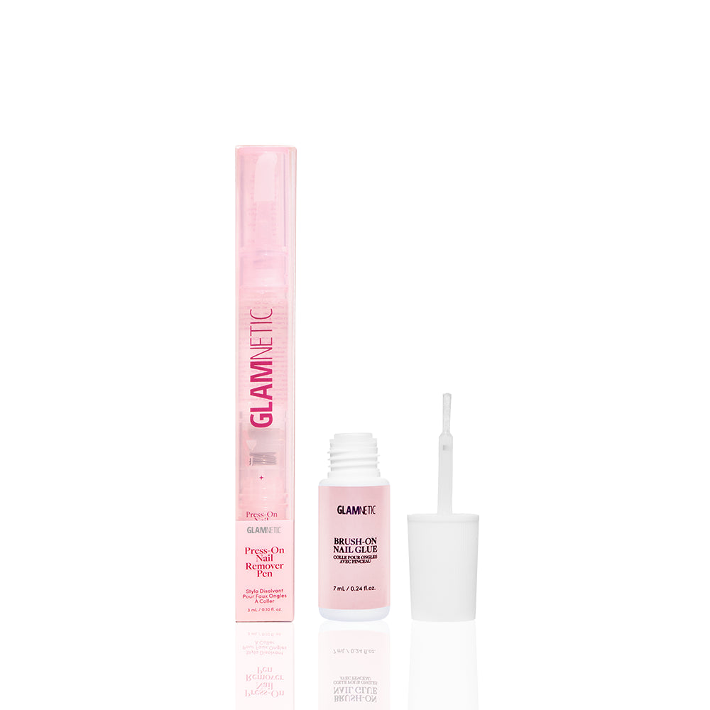 A Brush On & Click Off press-on nail remover pen sits beside an open bottle of brush-on nail glue with an applicator brush. - Product image