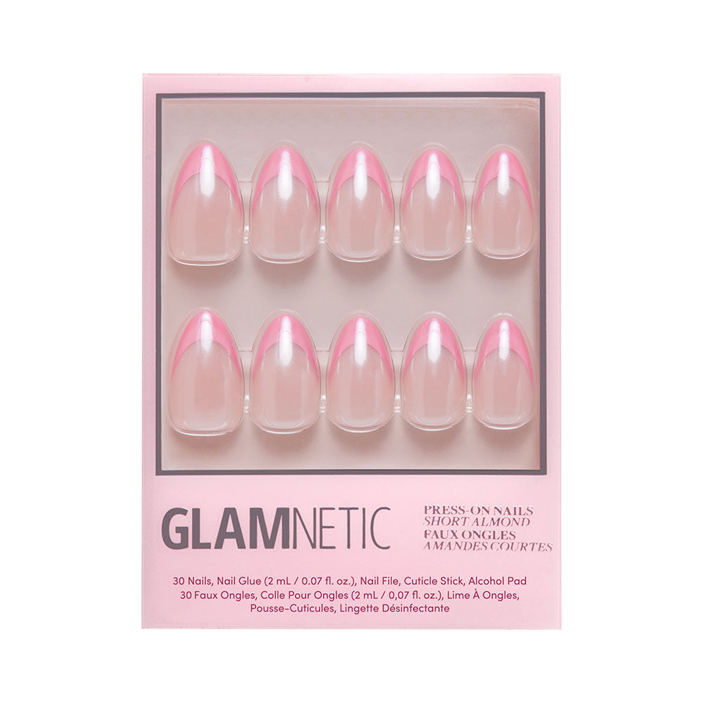 The Bubble Gum Glaze kit by glamnetic features 10 almond-shaped press-on nails with pink French tips, plus nail glue, a cuticle stick, and an alcohol pad in branded packaging. - Product image