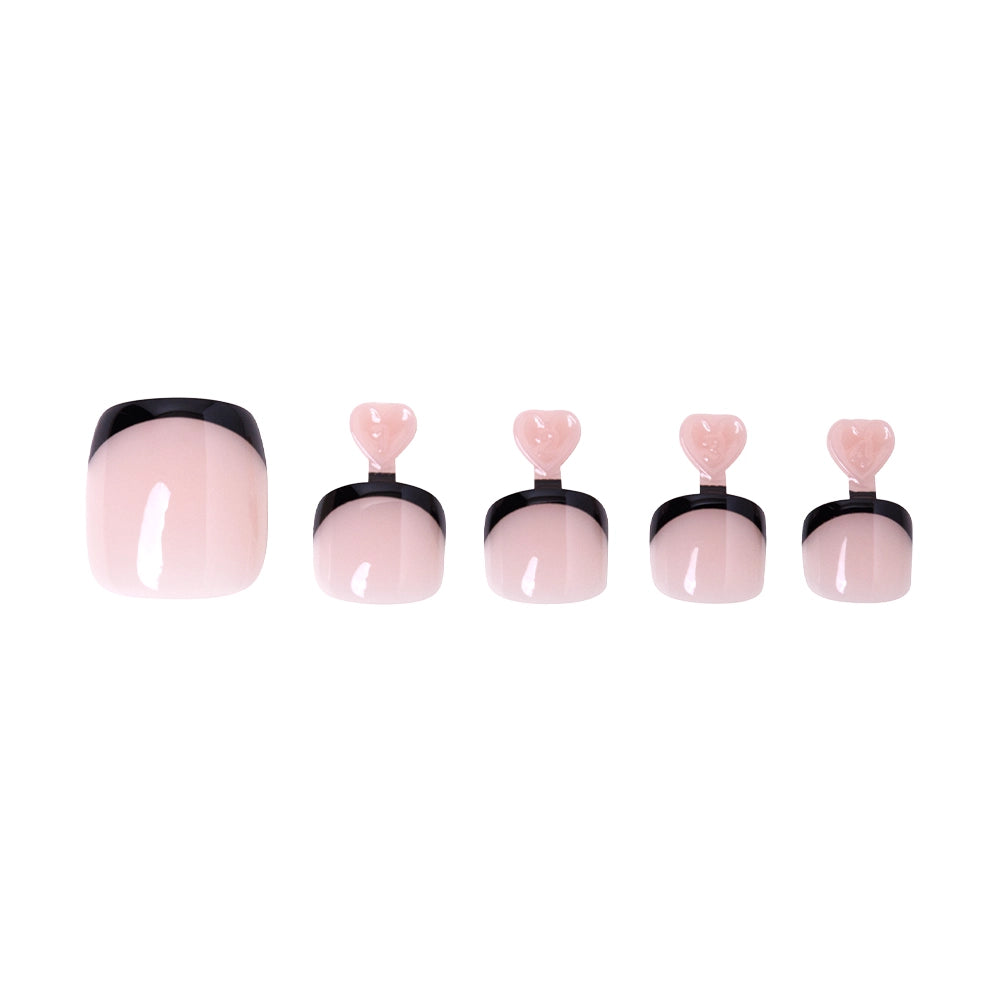 Display of a 5-piece set of pink Glamnetic press-on toenails with glossy black French tips. - Product image