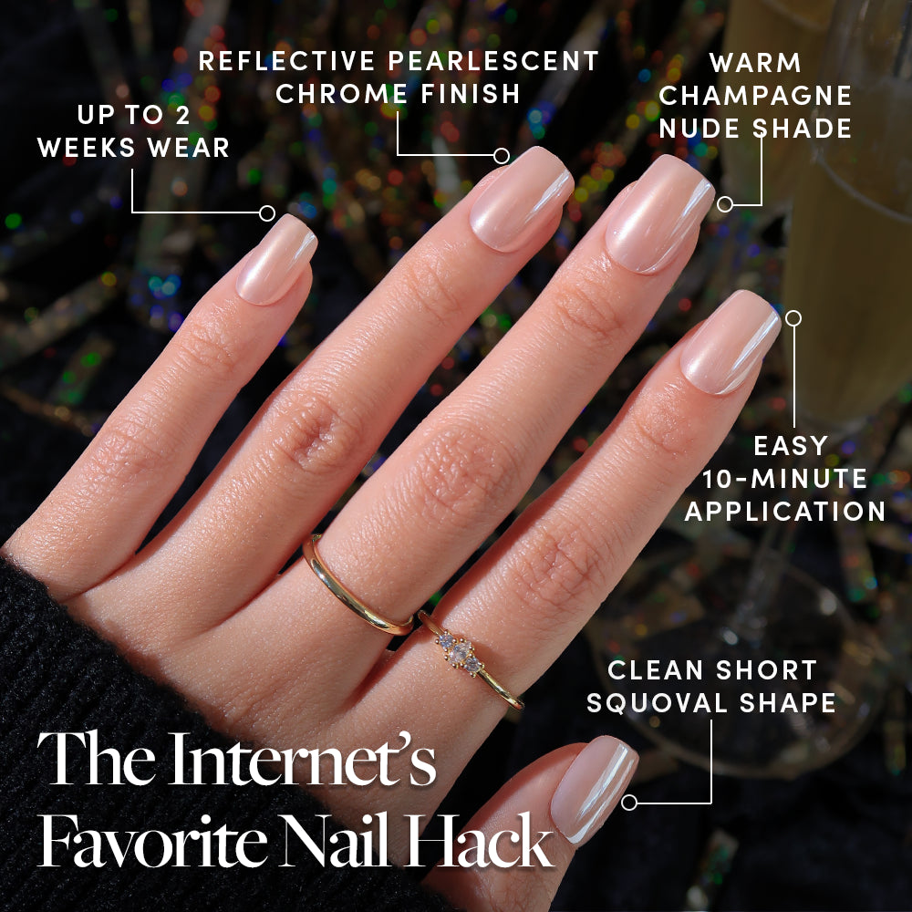 A hand wearing short, squoval, pearl chrome Champagne Veil press-on nails by Glamnetic, featuring a 10-minute application time and up to two weeks of wear. - Product image