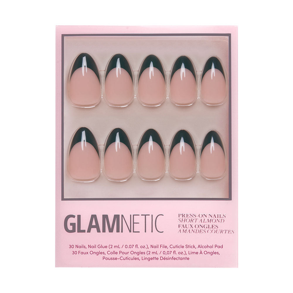 The Château Nail Set by glamnetic features press-on short almond nails with a nude base and dark green French tips, arranged in two rows inside chic pink packaging. - Product image