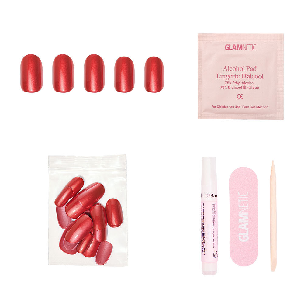 The glamnetic Cherry Glaze set includes short round press-on nails in vibrant cherry-red, plus an alcohol pad, extra nails, nail glue, a pink nail file, and a wooden cuticle stick—all displayed on a white background. - Product image