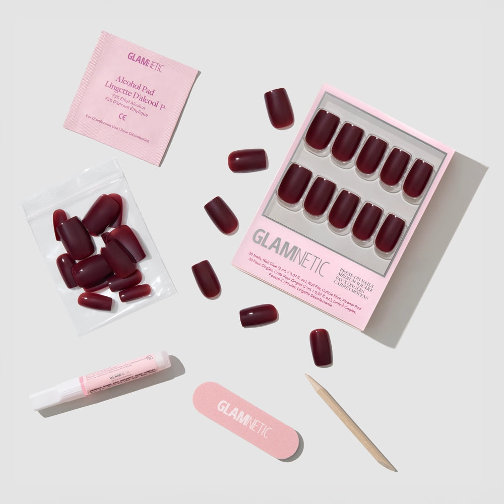 Cherry Mocha by glamnetic: medium square, cherry brown gloss press-on nails with pink nail file, wooden cuticle stick, nail glue, alcohol pad, and extra nails—vegan and cruelty-free formula. Arranged neatly on a white background. - Product image