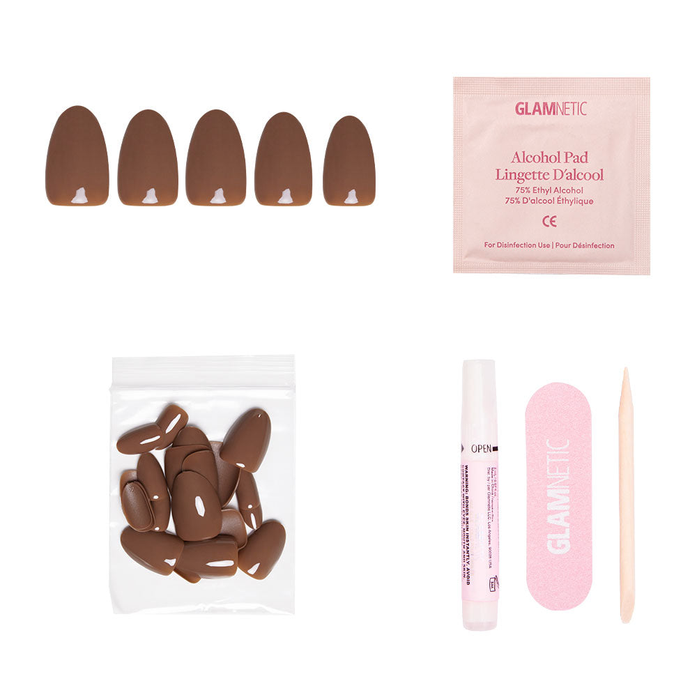 The glamnetic Chocolate Brown Nail Set includes press-on nails, an alcohol pad, extra nails, nail glue, a pink file, and a wooden cuticle stick—perfect for cozy Fall Forest-inspired manicures on a white background. - Product image