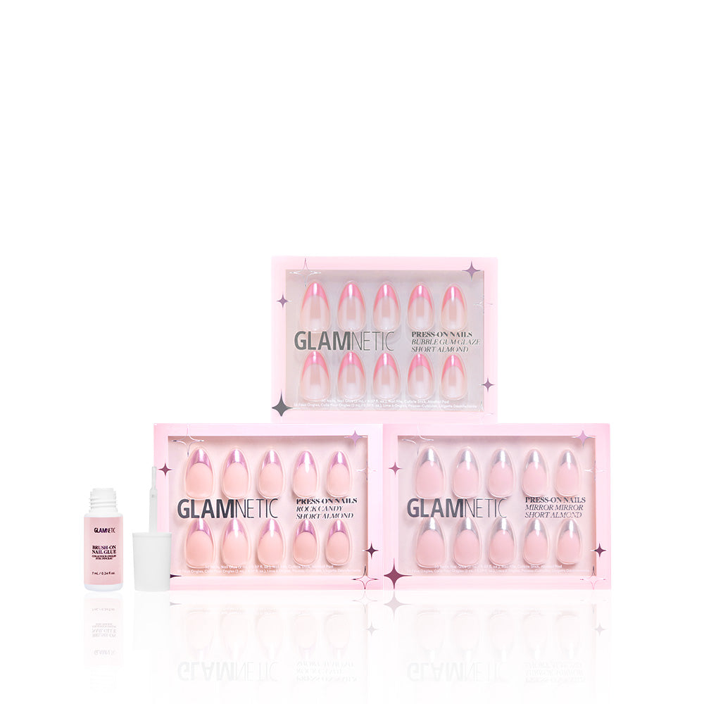 Three sets of glamnetic Chrome Tips press-on nails are stacked in pink packaging, with a small open bottle of nail glue to the left on a white background. - Product image