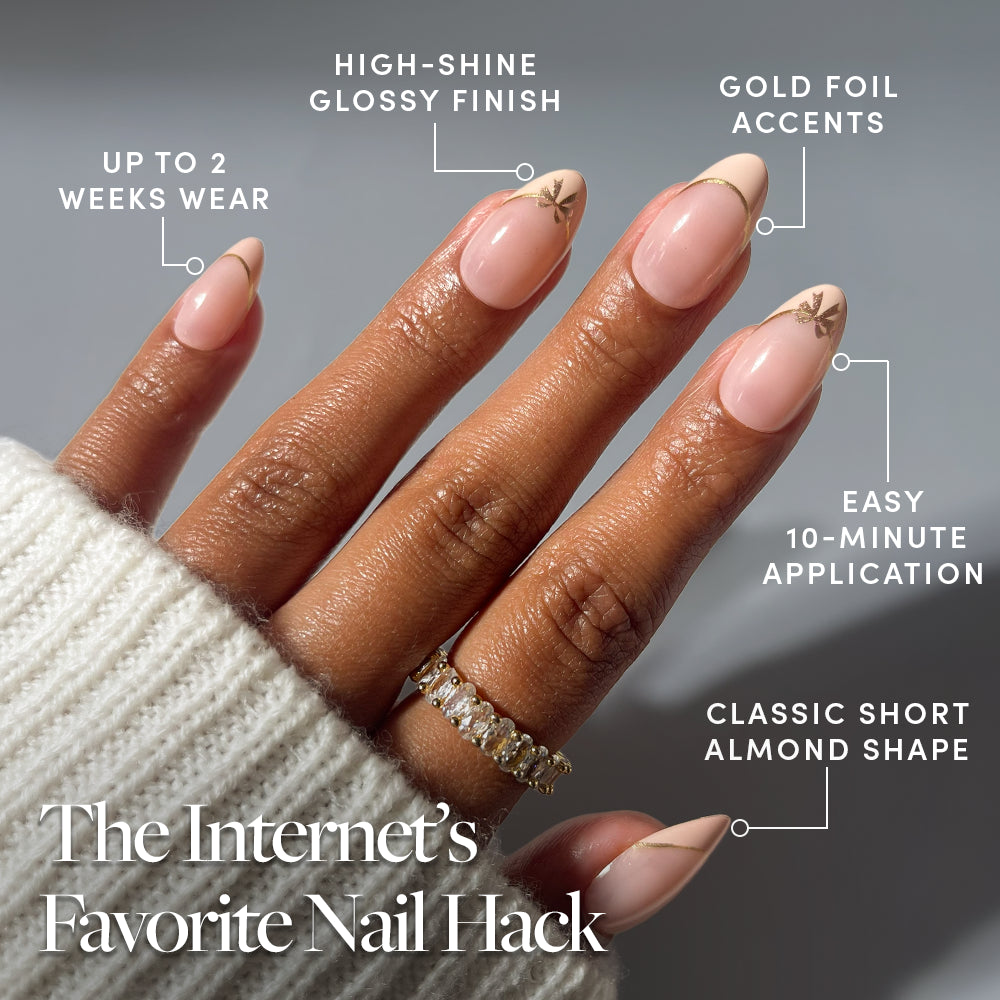 A hand wearing Cindy Lou by glamnetic short almond vegan press-on nails with gold foil accents, with callouts for their high-shine finish, two-week wear, ten-minute application, and shape. - Product image