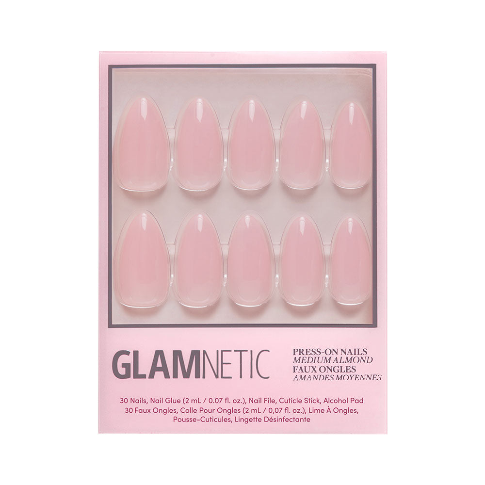 A box of glamnetic Cloud 9 press-on nails in a pointed almond shape and light pink color. Includes 30 nails, nail glue, cuticle stick, nail file, and alcohol pad—everything you need for salon-quality nails at home. - Product image