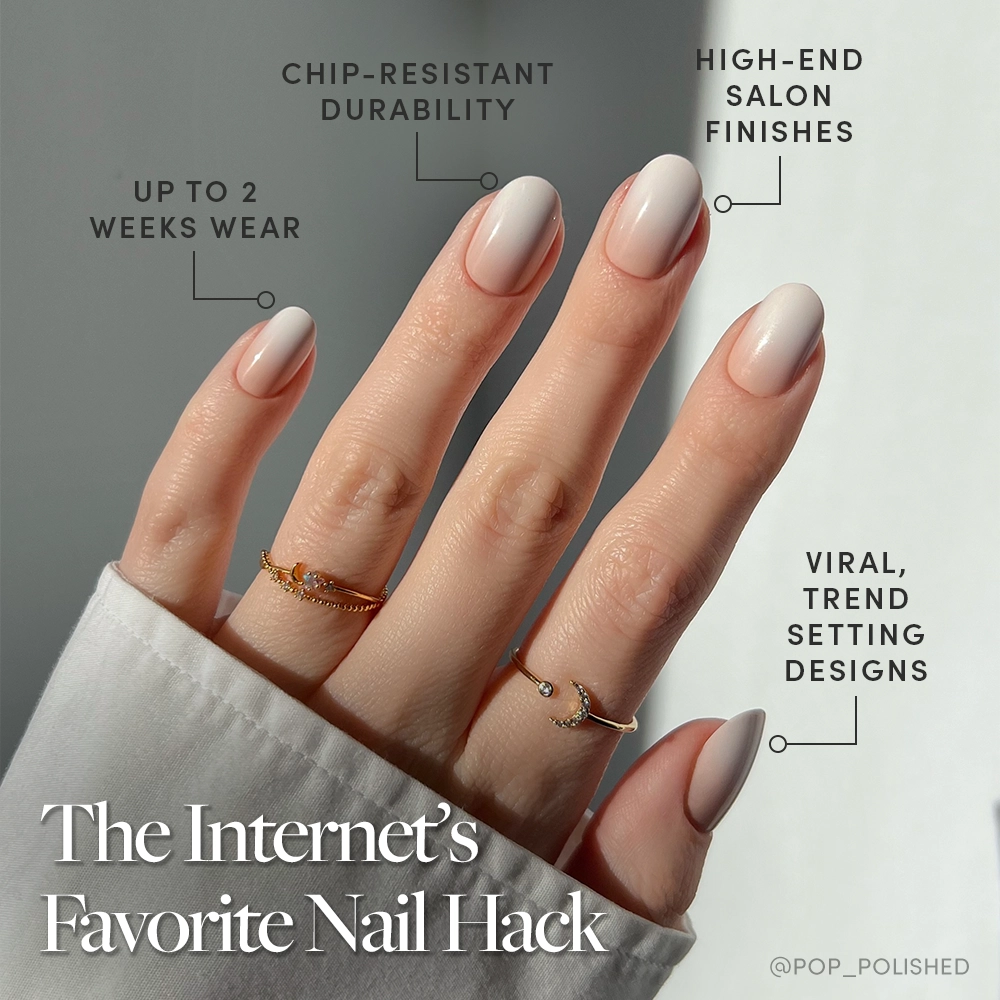 A hand with almond-shaped, light nude Creamer vegan nails by glamnetic wears three gold rings against a soft background. Text highlights two weeks’ wear, chip-resistant durability, salon finishes, and trendsetting designs. - Product image