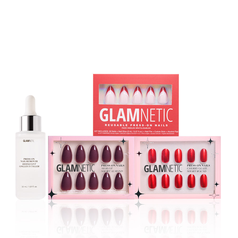 A bottle of glamnetic cuticle oil with dropper and three boxes of reusable press-on nails in Crimson Charm shade, displayed on a white background. - Product image