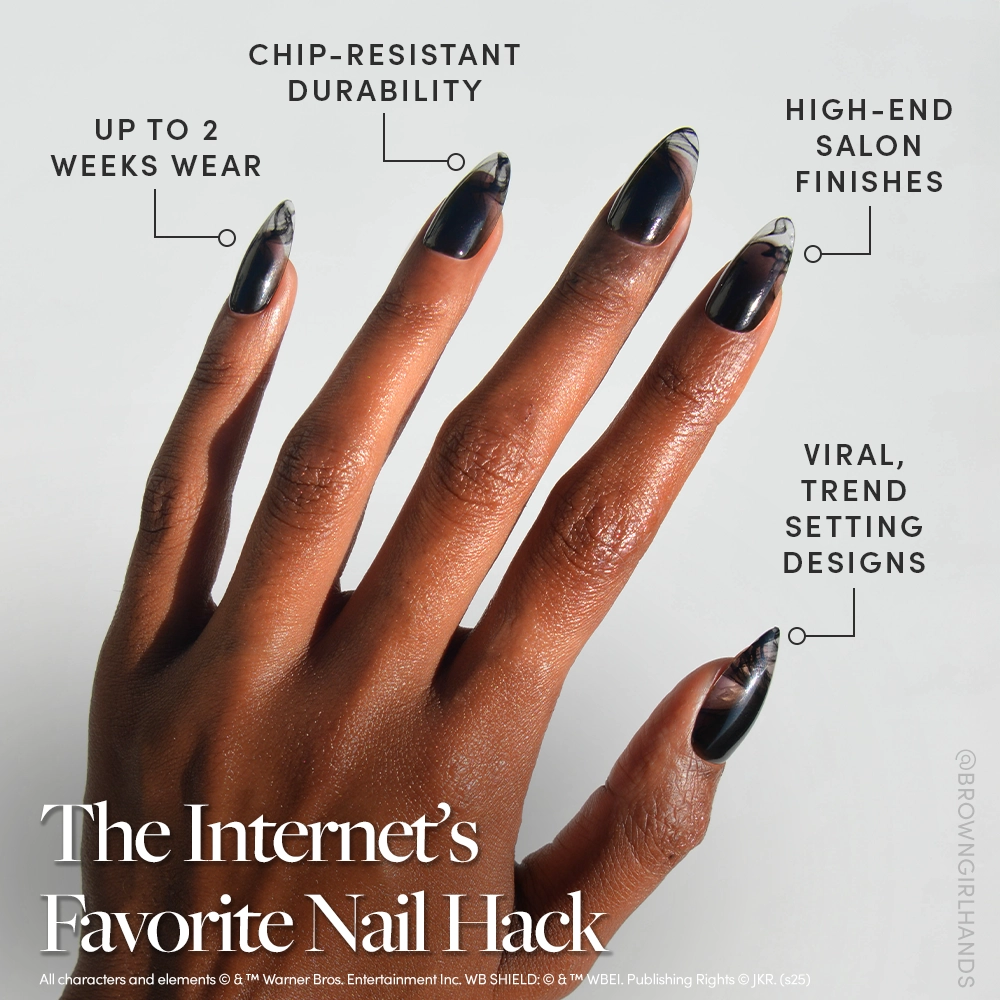 A hand showcases glamnetic's Dementor™ almond-shaped press-ons in a stylish black-to-clear gradient. Features include up to 2 weeks’ wear, chip-resistant durability, salon-quality finish, and trending viral designs. - Product image