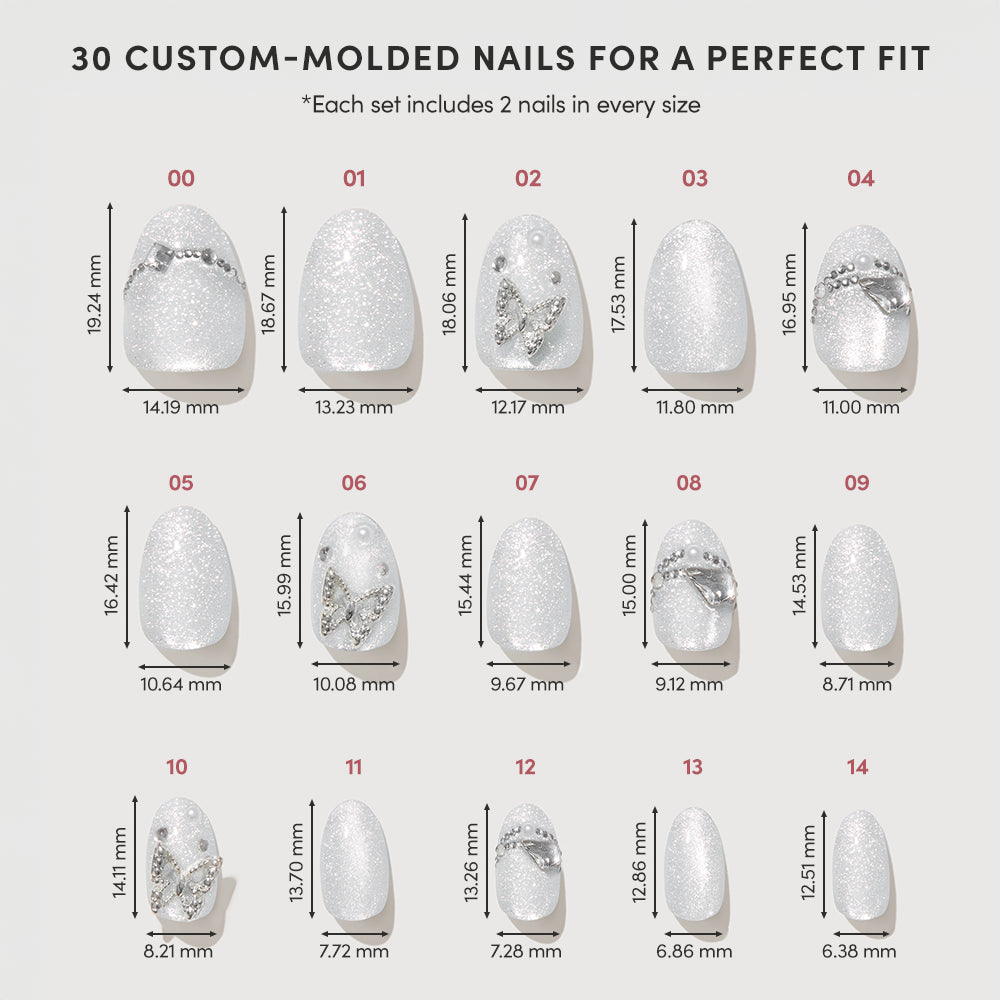 A chart showing 15 glamnetic Diamond press-on nails in short oval style, each featuring sparkly white rhinestones, silver accents, and 3D art. Nail sizes are labeled with width and length measurements in millimeters. - Product image