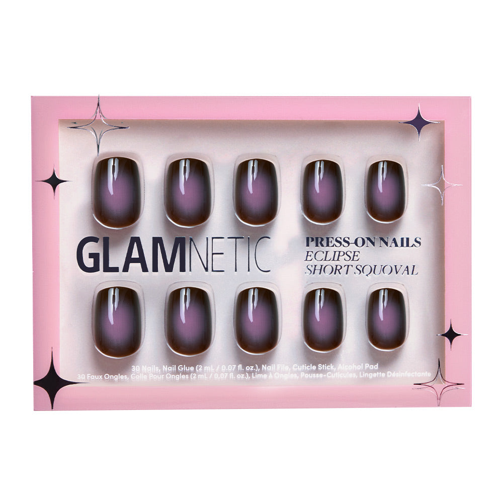 A box of glamnetic Eclipse press-on nails in a short squoval shape with a black and purple gradient design, packaged in vibrant pink. - Product image