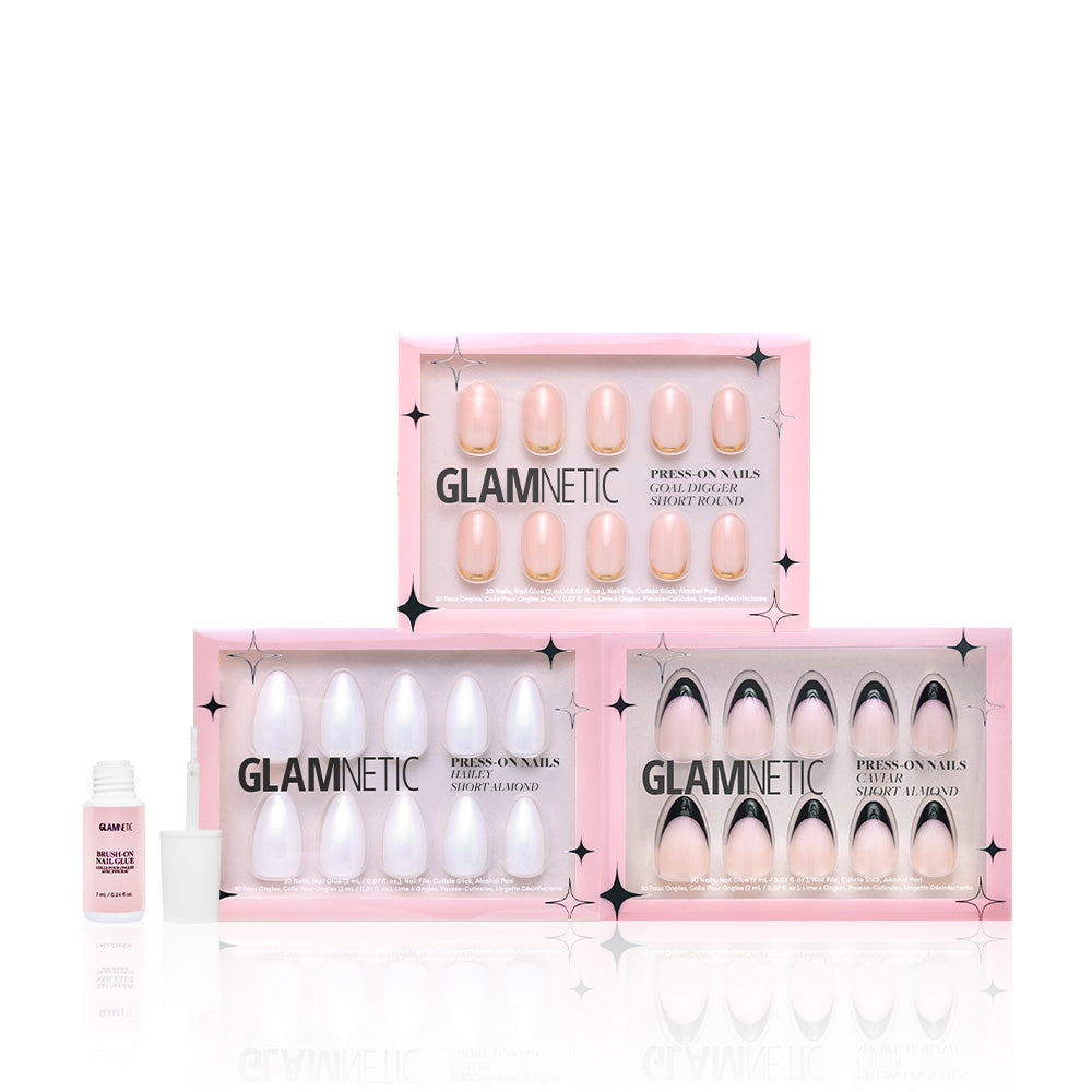Three pink boxes of glamnetic Elevated Everydays press-on nails are displayed in a row with a small bottle of Nail Glue in front, all set against a white background. - Product image