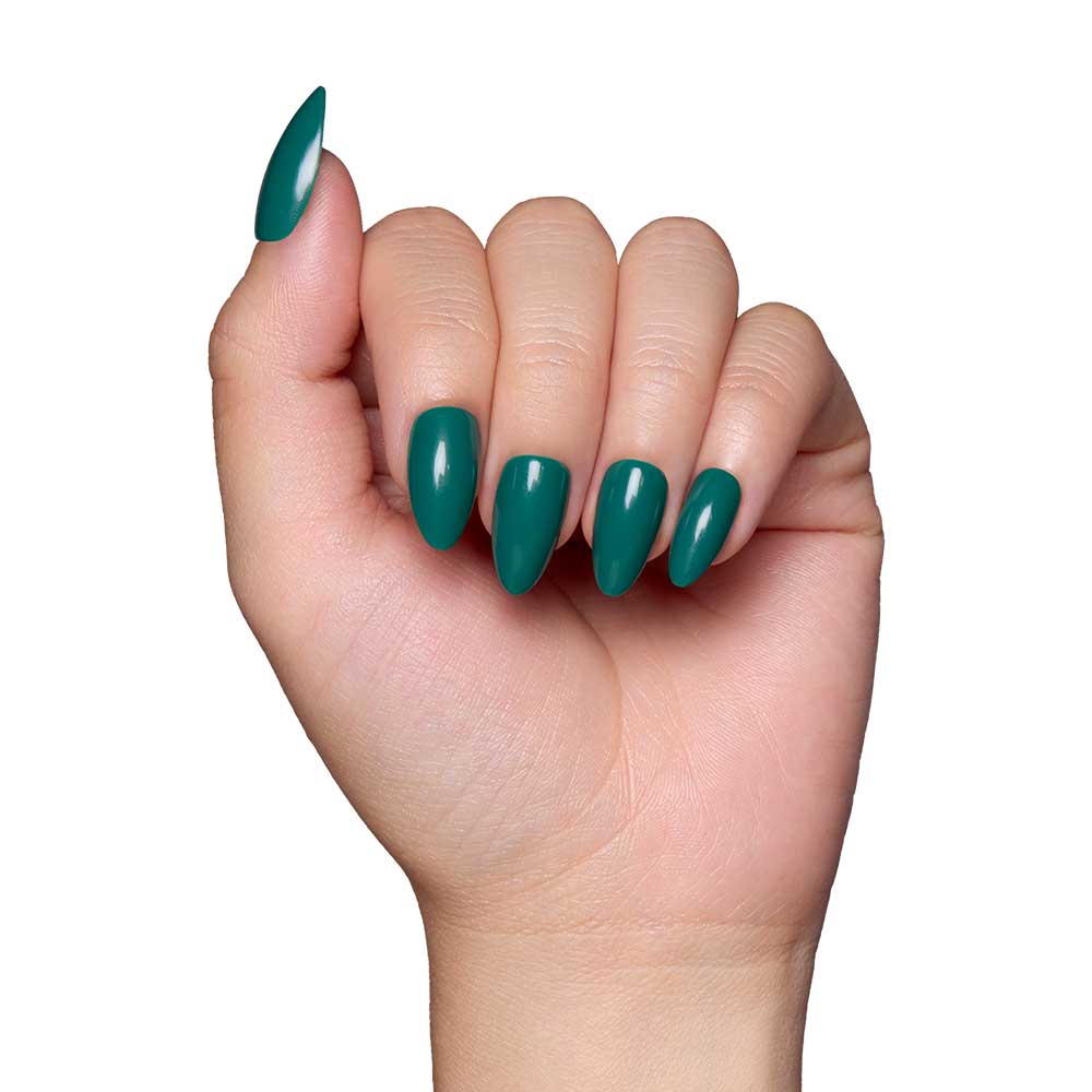 A hand with long, almond-shaped nails painted in glamnetic’s Emerald Green, a glossy polish, shown against a white background. - Product image