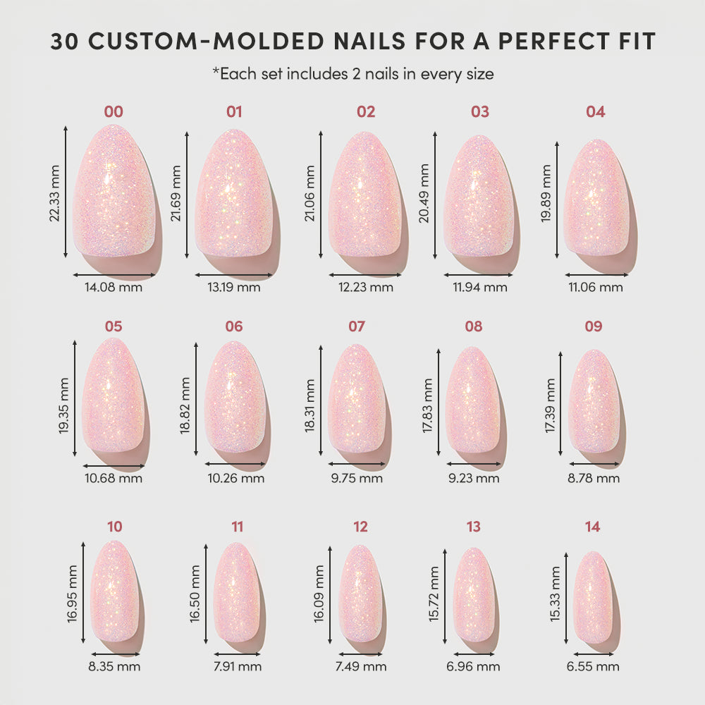 A chart shows 15 sizes of glamnetic's FAIRY FLEXX pink, glittery vegan cruelty-free nails, each labeled with width and length in millimeters. Each set includes 2 nails per size for a total of 30 short almond press-on nails. - Product image