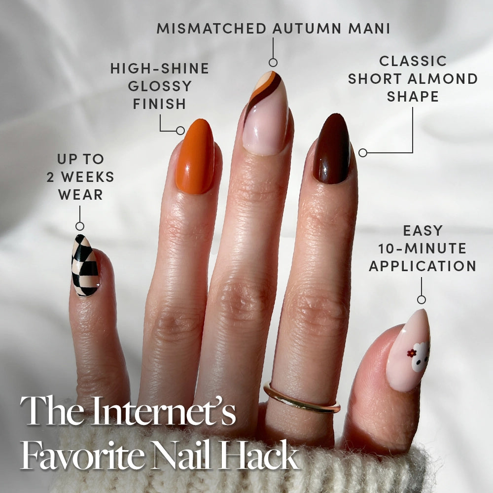 A hand with five short almond nails in unique designs—geometric to floral—showcasing glamnetic’s Fall Boo. Enjoy up to 2 weeks of chip-resistant, salon-quality wear with trendy styles. Fall Boo Nail Set restock available now!. - Product image