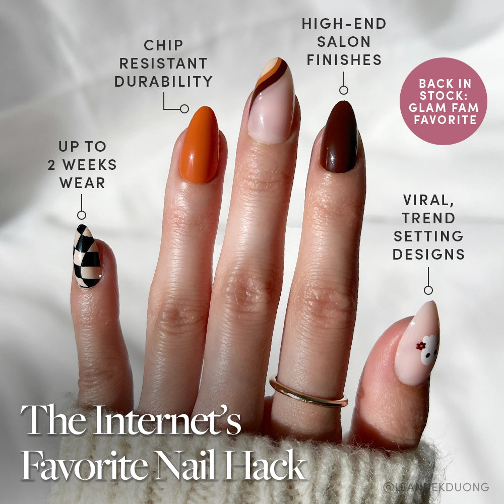 A hand with five short almond nails in unique designs—geometric to floral—showcasing glamnetic’s Fall Boo. Enjoy up to 2 weeks of chip-resistant, salon-quality wear with trendy styles. Fall Boo Nail Set restock available now!. - Product image