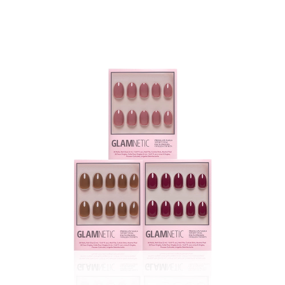 Three boxes of glamnetic Sweater Weather Ovals press-on nails are displayed against a white background. Each box contains ten short oval nails in shades of pink, nude, and burgundy, arranged in two rows and offering durable wear with a high-shine gloss for a flawless manicure. - Product image