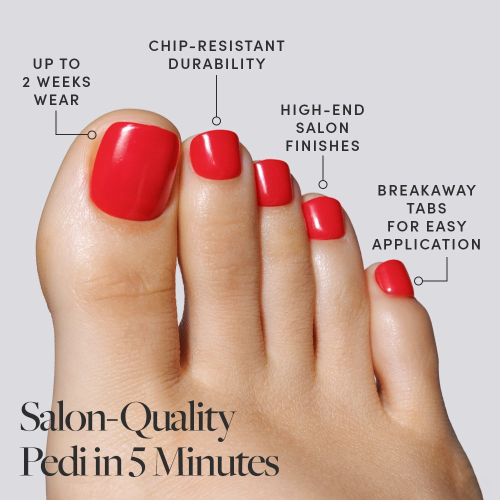 A bold red set of Glamnetic press-on toenails on a foot, described with durability and salon-finish benefits. - Product image
