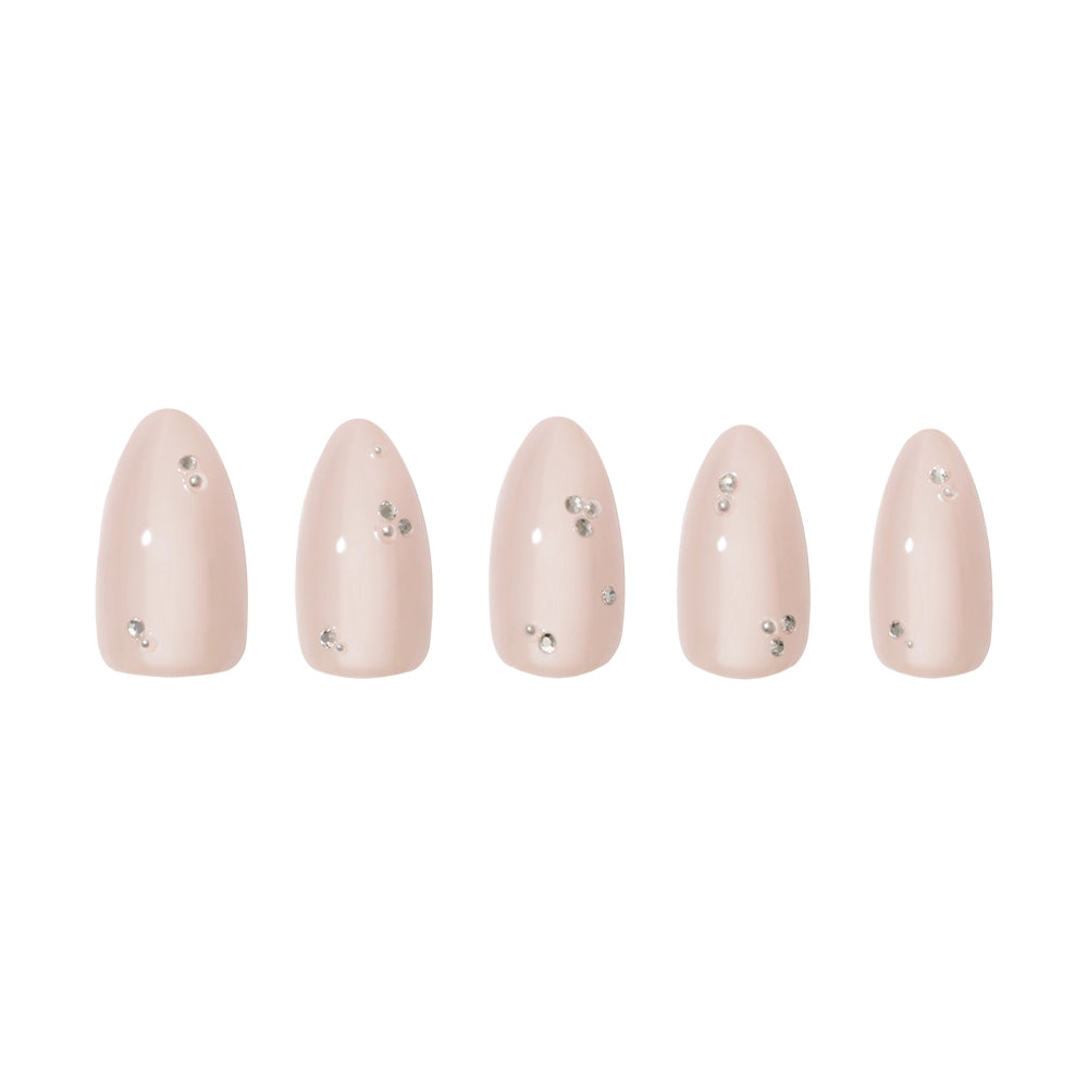 Five glossy, pale nude artificial nails from glamnetic’s First Dance set feature silver rhinestones and delicate 3D pearls on each vegan nail, displayed elegantly against a white background. - Product image