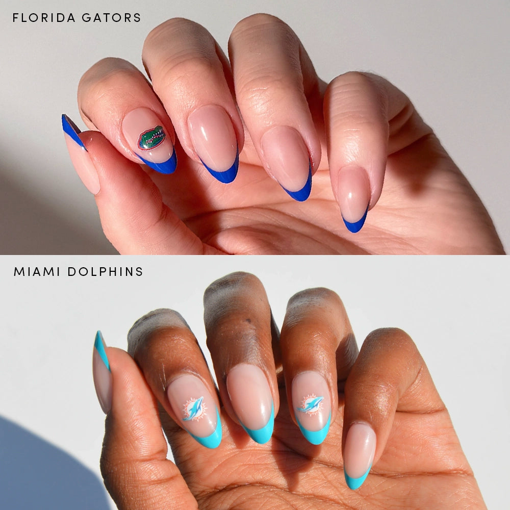 Two manicured hands show off glamnetic's Florida All-Stars nails: the top hand boasts nude nails with blue French tips and a Florida Gators accent, while the bottom has nude nails with aqua tips and two Miami Dolphins accents. Officially licensed.