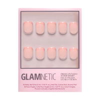 A box of glamnetic French Peach Press-On Nails in pale pink includes 10 super short, rounded nails arranged in two rows on a pink background. Vegan and cruelty-free.