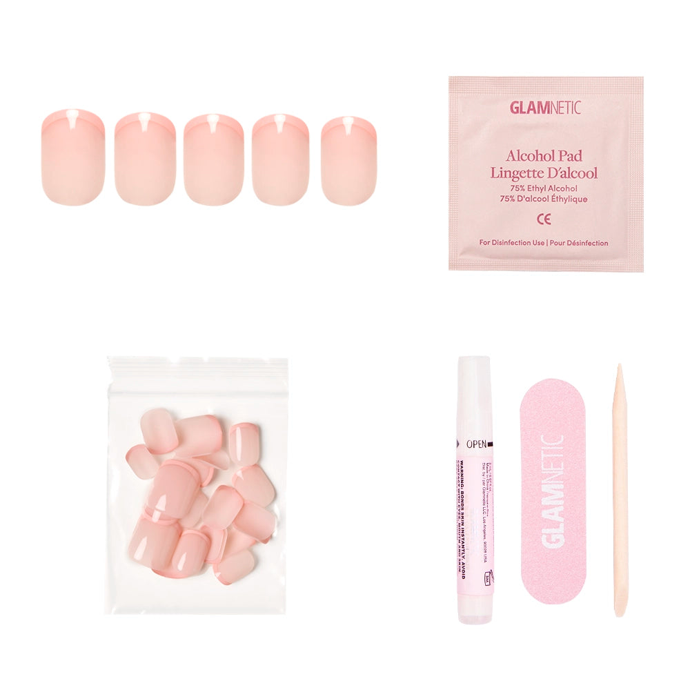The glamnetic French Peach set includes vegan, cruelty-free pink press-on nails, an alcohol pad, extra nails, a glue pen, a pink nail file, and a wooden cuticle stick—all displayed on a white background. - Product image