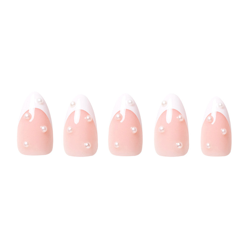 French Pearl by glamnetic: five short almond nails with a pale pink base, white wavy tips, and pearl-like beads for a chic bridal look. Shown on a white background. - Product image