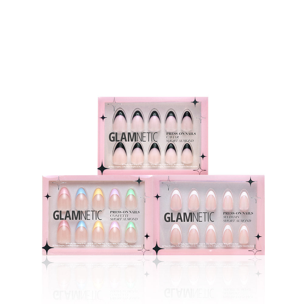 Three boxes of the glamnetic Frenchie Bundle press-on nails, in pink packaging with pastel and nude designs, are arranged in a triangular stack against a white background. - Product image