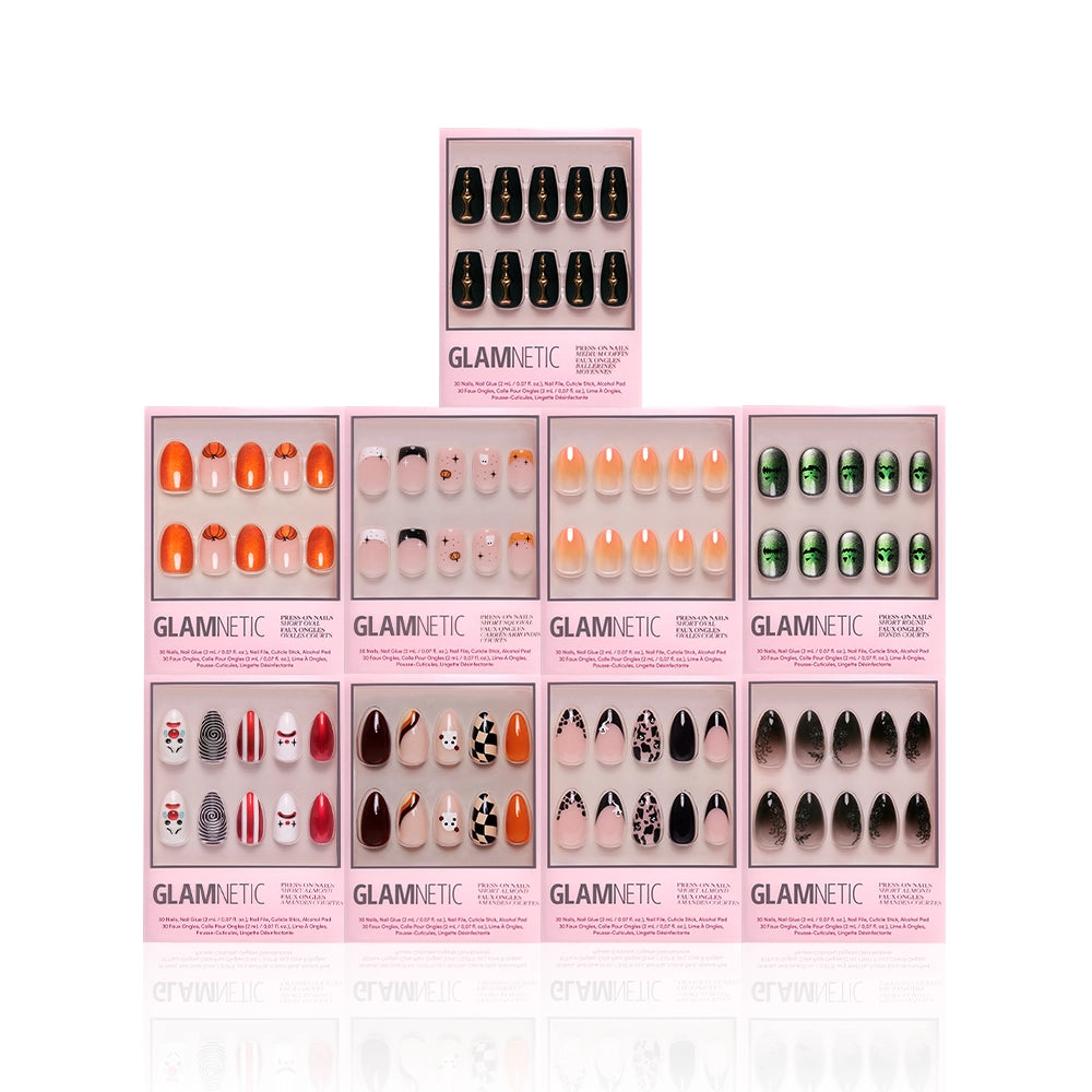 Nine boxes of glamnetic Funhouse Fantasy press-on nails in assorted colors and designs—including Halloween pumpkin styles, orange, black, nude, pink, green, and animal prints—are displayed in three rows on a white background. - Product image