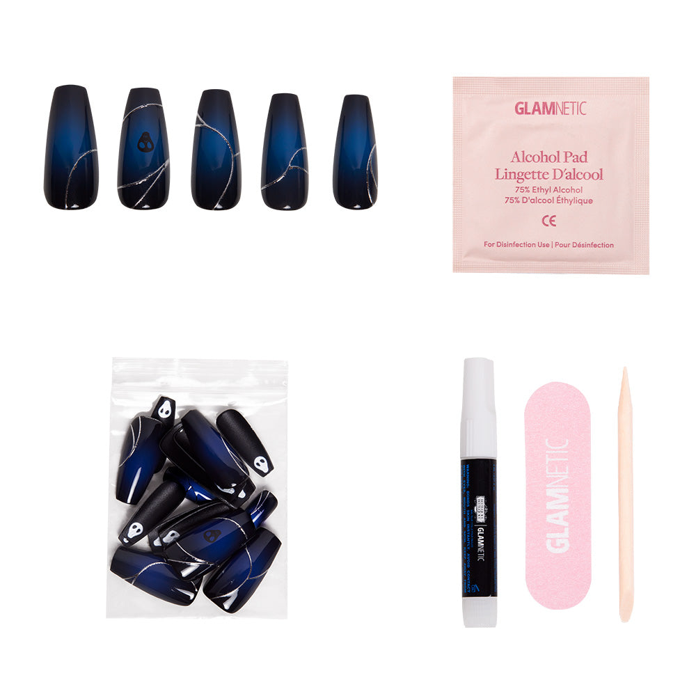 The glamnetic Ghost House Nail Set features blue and black gradient coffin nails with white lines, extra nails in a plastic bag, an alcohol pad, nail glue, a pink nail file, and a wooden cuticle stick—all displayed on a white background. - Product image
