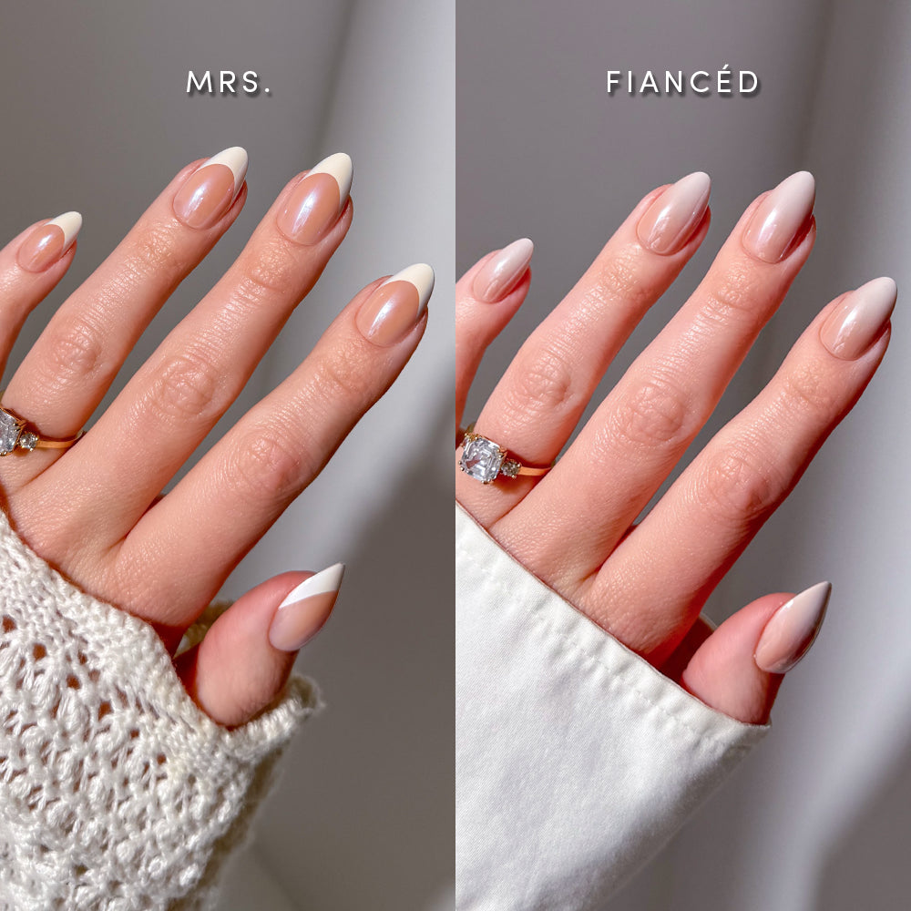 Two hands with engagement rings display distinct manicures: the left hand features glamnetic Glazed Almonds Glam press-on nails in an almond shape with sleek white tips, while the right shows softly rounded, pale pink nails. Above, labels read Mrs. and Fiancé. Both hands are dressed in white sleeves, highlighting their salon-quality manis—ideal for any special occasion. - Product image