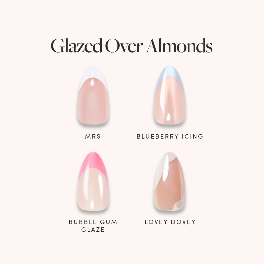 Introducing the “Glazed Over Almonds” press-on nails by glamnetic: This set features four almond-shaped, glossy-finish designs—“MRS” with a nude base and white French tip, “BLUEBERRY ICING” in nude with a blue tip, “BUBBLE GUM GLAZE” offering a glazed effect in nude and pink, and “LOVEY DOVEY,” a nude nail accented with a tan swirl. - Product image