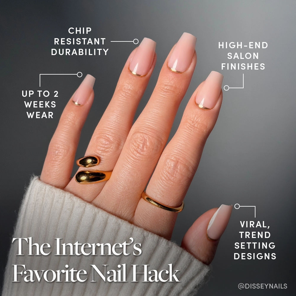 A hand with long, pale pink "Gold Goals" coffin nails by glamnetic and gold rings displays key features: salon-quality, chip-resistant durability, up to 2 weeks wear, luxe finishes, and viral trend-setting designs. - Product image
