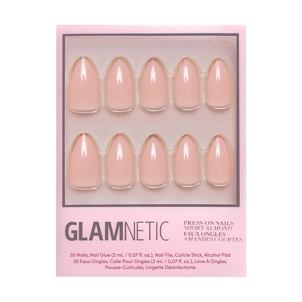 A box of glamnetic Gold Standard nails in soft pink almond shape, arranged in two rows of five inside clear packaging with product details printed below.