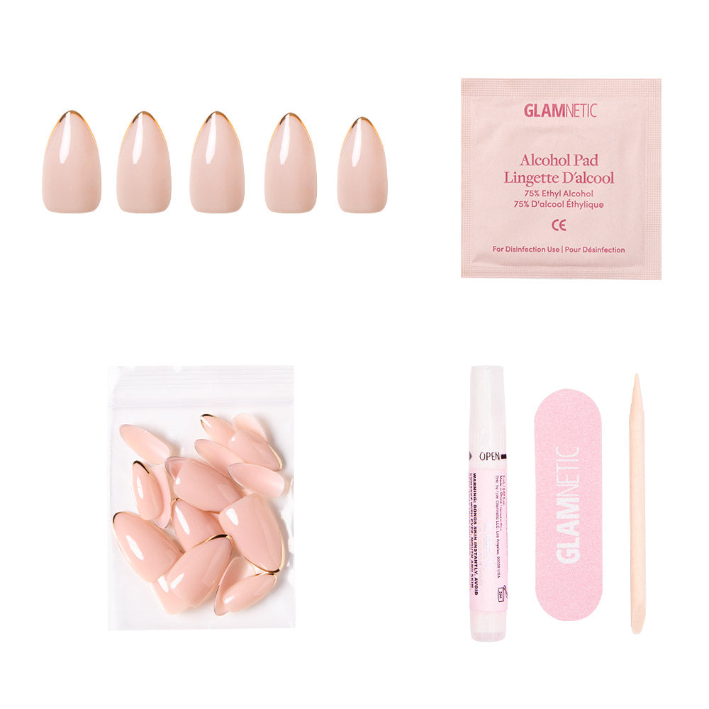Gold Standard by glamnetic: almond nude nails with metallic gold tips. Includes alcohol pad, extra nails, nail glue, pink file, and wooden cuticle stick—all displayed on a white background. - Product image