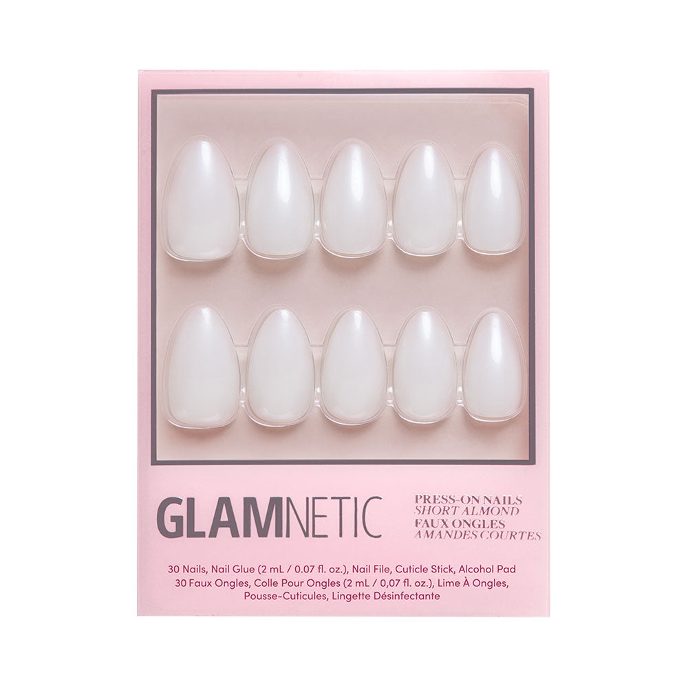 A pink glamnetic box displays the Hailey Nail Set: 10 short almond-shaped press-on nails for a glazed donut look. The set includes nail glue, a file, cuticle stick, and alcohol pad. - Product image