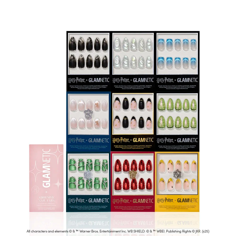 A display of twelve glamnetic Harry Potter™ x Glamnetic Collection press-on nail sets in assorted colors and designs, arranged in a grid, with a pink glamnetic accessories box on the left for a magical manicure. - Product image