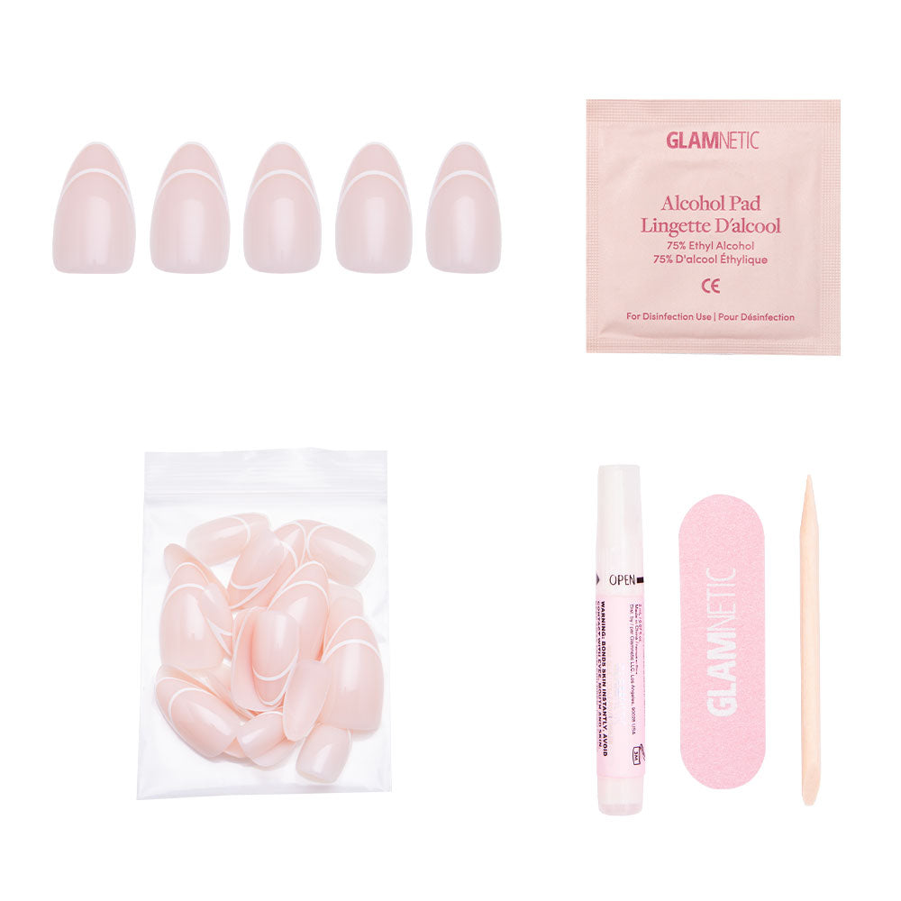 The glamnetic Heavenly press-on nail kit includes pink, short almond nails, an alcohol pad, nail file, cuticle stick, adhesive, and extra nails in a clear bag—all displayed on a white background. - Product image
