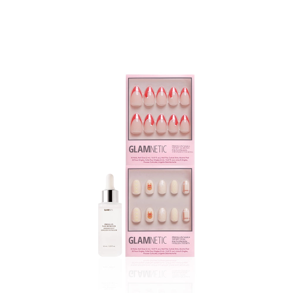 A bottle of glamnetic cuticle oil with a dropper sits next to the glamnetic Holiday Duo in a pink box, showcasing red French tip and white Christmas press-on nails on a white background. - Product image