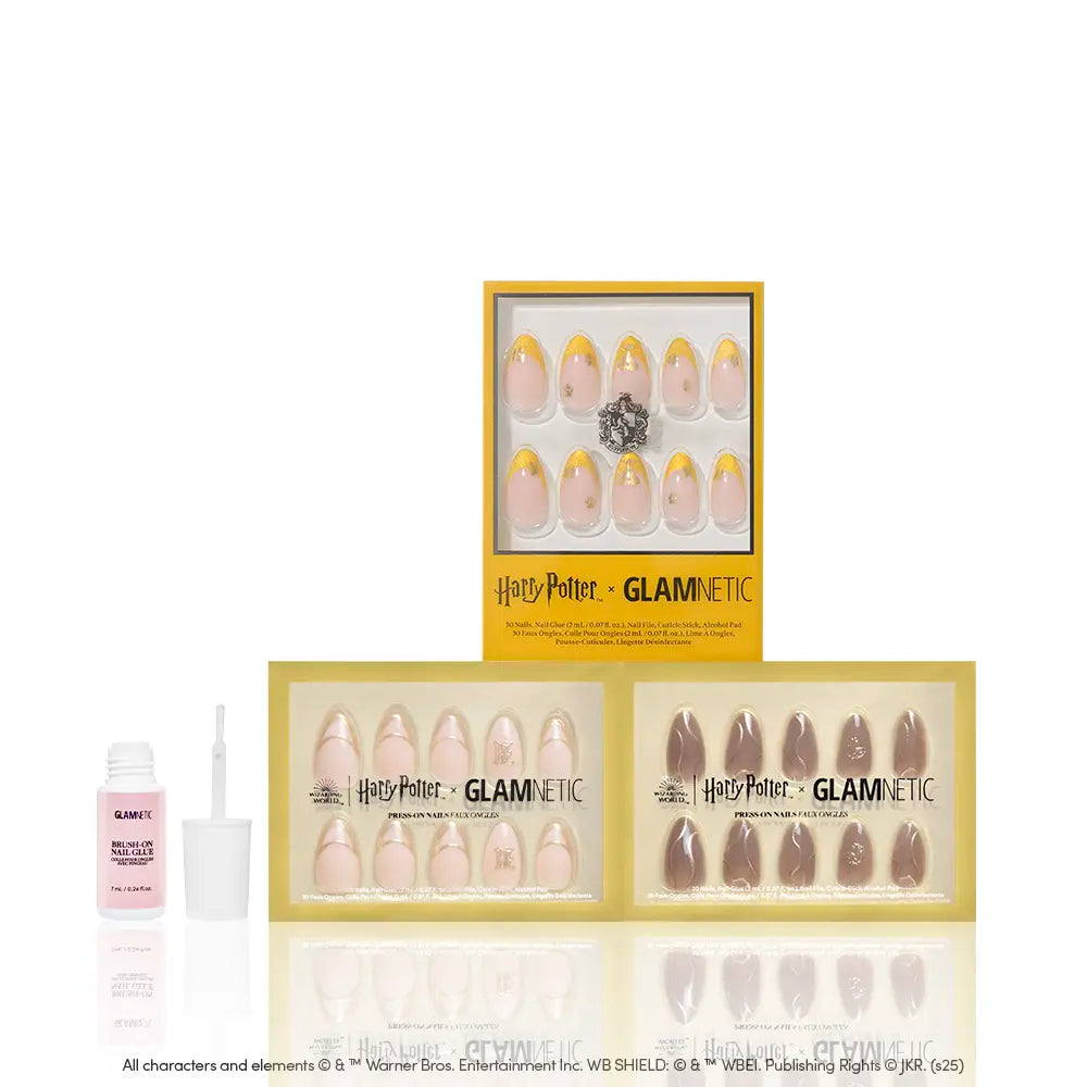 Three boxes of glamnetic House Hufflepuff™ press-on nails with golden designs and almond shapes are shown with a small nail glue bottle and nail file, all arranged on a clean white background. - Product image