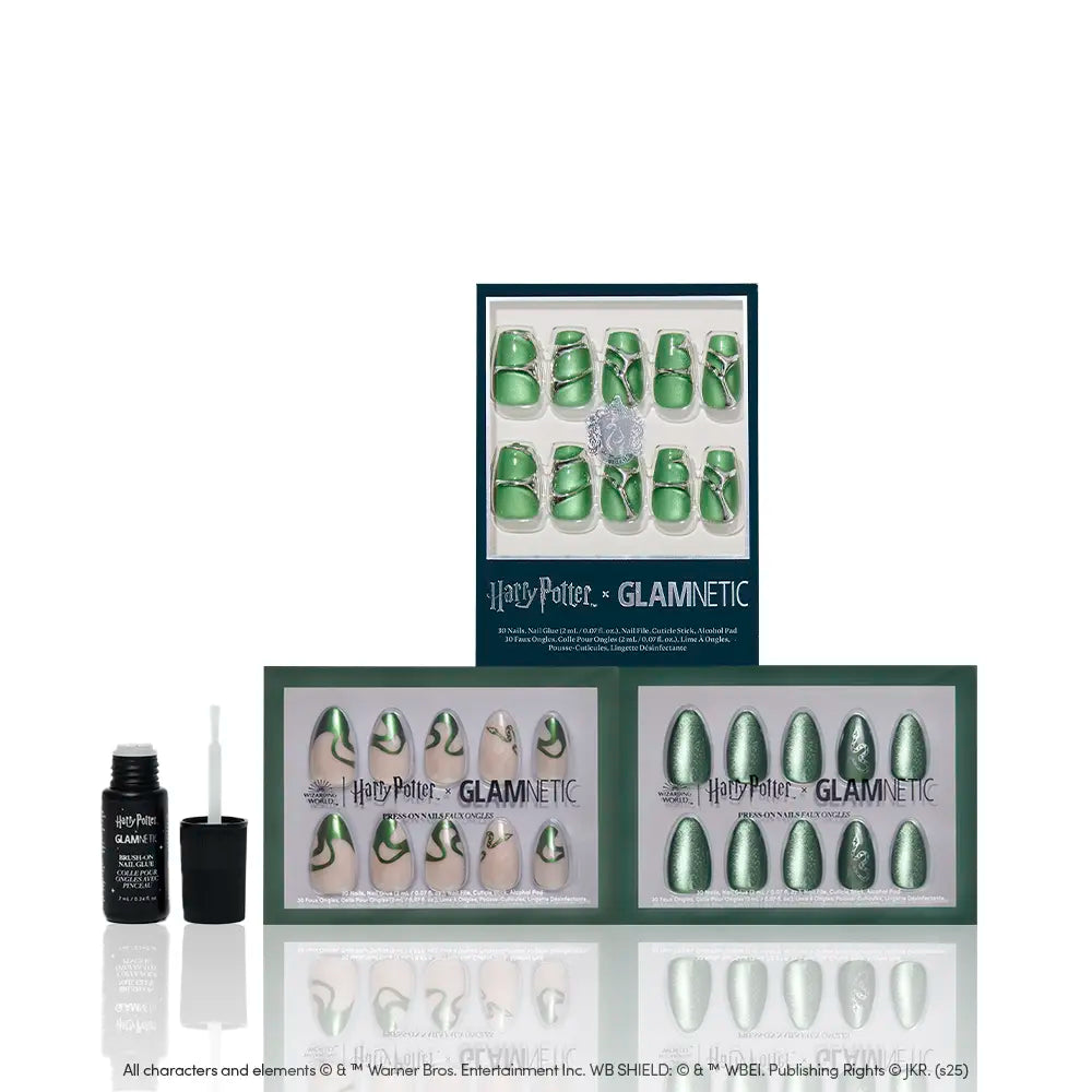 The glamnetic House Slytherin™ nail set features emerald green velvet nails with Slytherin-inspired designs, displayed in three open boxes and includes a bottle of nail glue. - Product image