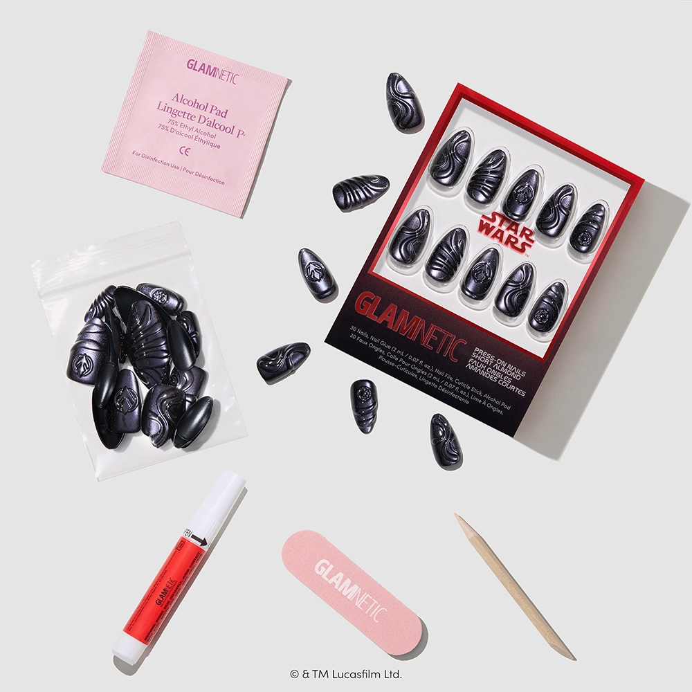 I Am Your Father - Introducing the glamnetic “I Am Your Father” press-on nails kit—a STAR WARS-inspired set featuring sleek black Darth Vader nails with a luxurious velvet finish. Each kit includes nail glue, a pink nail file, a wooden cuticle stick, an alcohol pad, and a small bag, all beautifully arranged on a white background. Embrace the power of the galaxy with these stunning press-on nails inspired by your favorite saga!.