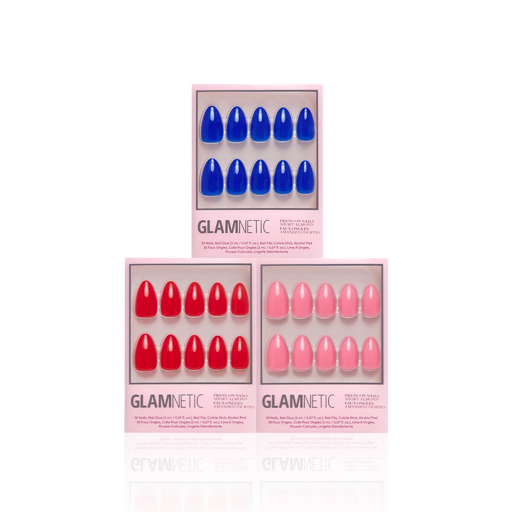 Three boxes of glamnetic It Girl Summer press-on nails are shown, featuring Cobalt Blue, Fiery Red, and Flamingo Pink shades. Each box displays ten nails neatly arranged in two rows. - Product image
