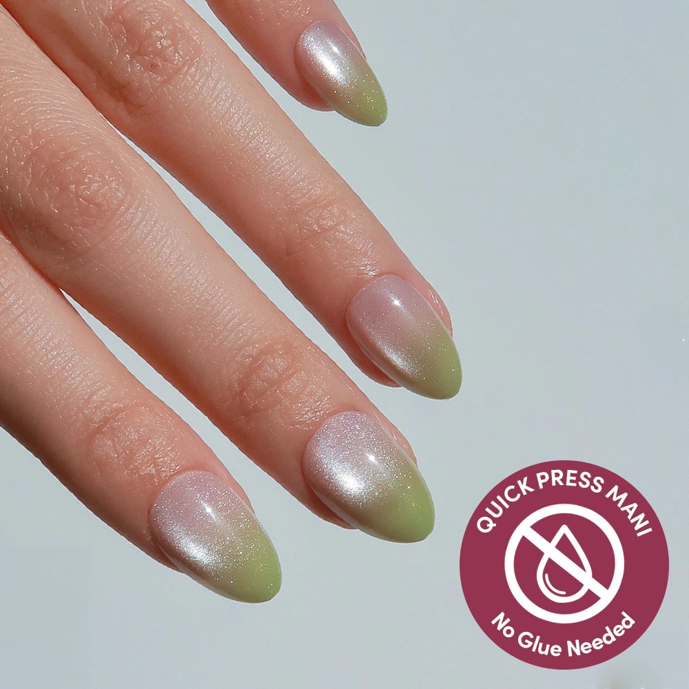 A hand shows off glamnetic Lime Beam press-on nails in a shimmery, pink-to-green gradient with an almond shape. A corner badge reads: Quick Press Mani – No Glue Needed.