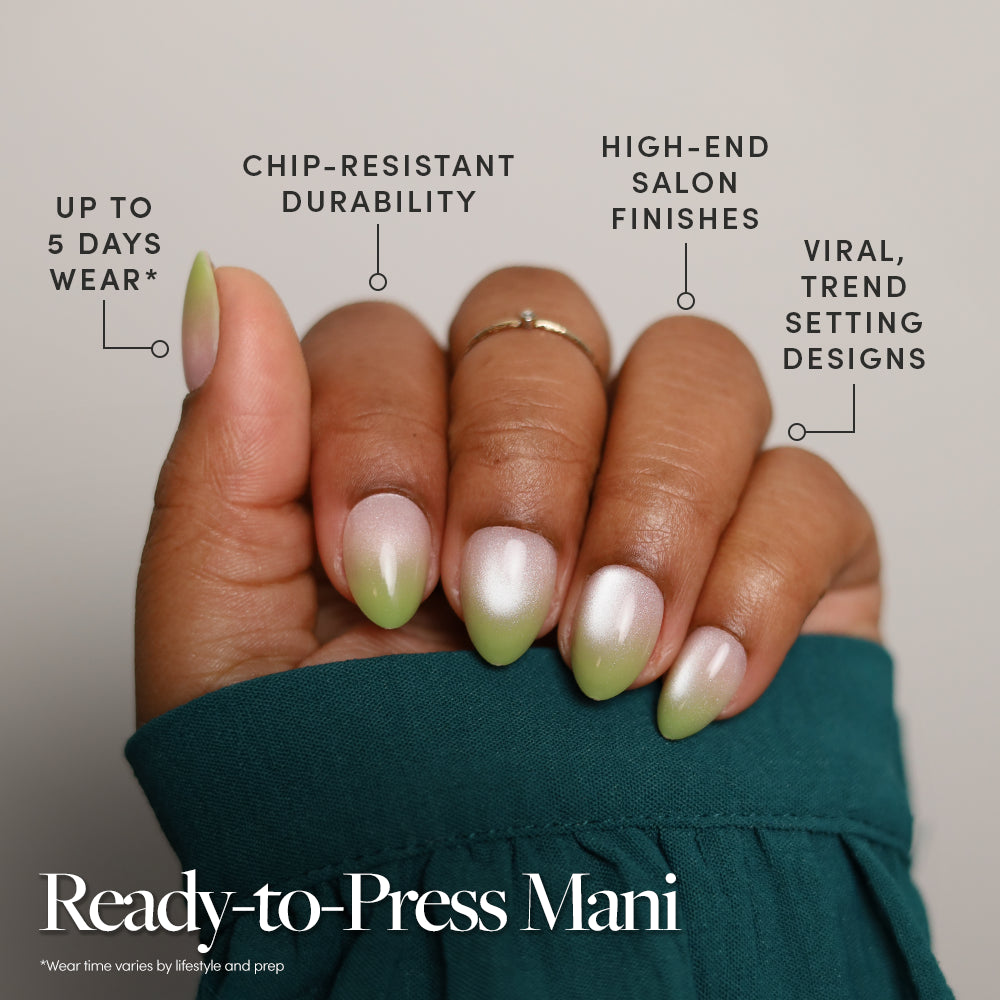 A hand with almond-shaped nails in a green and nude ombré design wears glamnetic’s Lime Beam. In the corner, a badge reads Quick Press Mani, No Glue Needed with a crossed-out glue icon—highlighting easy stick-on nails for flawless style. - Product image
