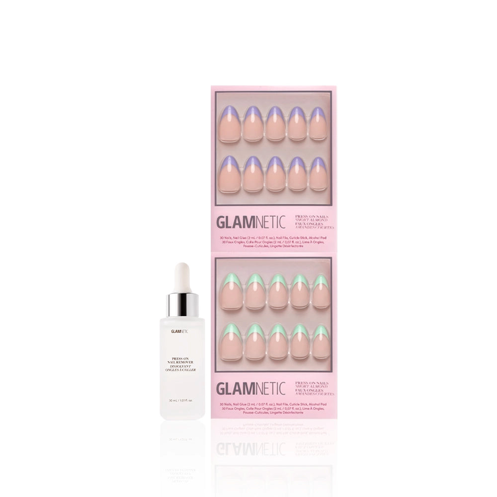 Two sets of glamnetic La Vie en Almonds press-on nails, short almond French tips in pastel mint and lilac, are shown in pink boxes next to a white serum dropper bottle, all set against a white background. - Product image