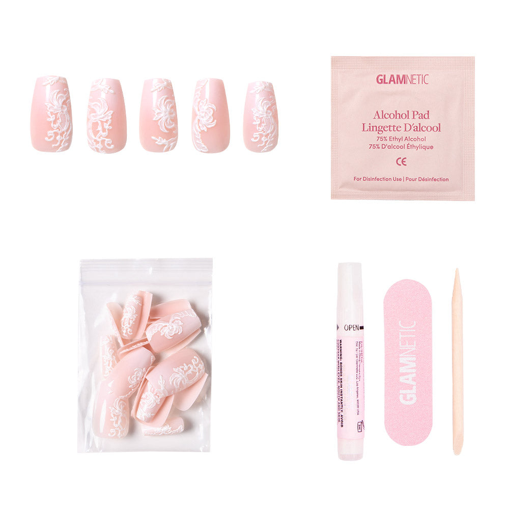 The glamnetic Lace Blush kit includes five pink coffin nails with white floral lace, extra pink floral nails, a nail file, wooden cuticle stick, nail glue, alcohol pad, all packed in a convenient pouch. - Product image